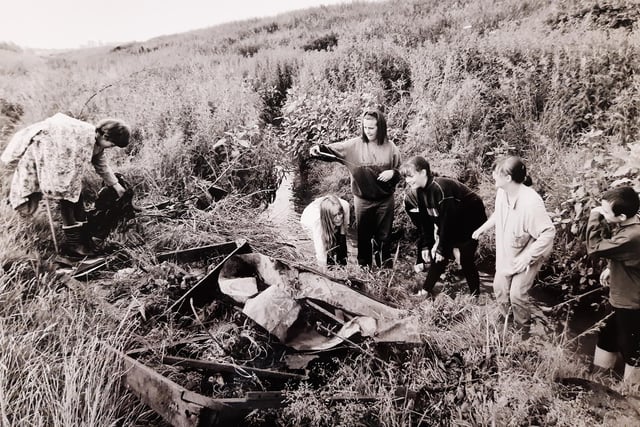 Pupils of East Leeds High School at Seacroft clearing rubbish from the overgrown Wyke Beck in July of 1994.