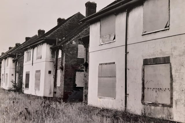 This was taken in July 1992  at Wykebeck Valley Road and the caption still with the photo reads "An eyesore row of flats at Gipton that have been dubbed a death trap by neighbours who fear someone could be killed unless immediate action is taken to board them up."