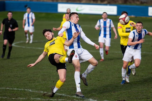 Ollie Fearon competes for the ball with Cleethorpes Town's Josh Smaller. Picture: Bruce Fitzgerald