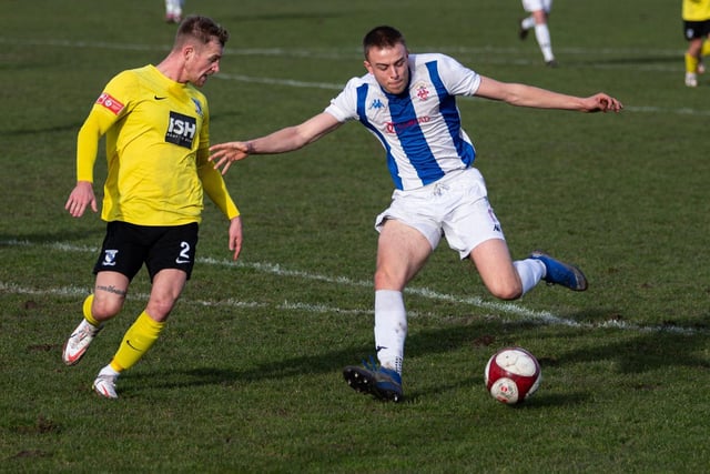 Lewis Whitham takes on Cleethorpes Town's Sam Topliss. Picture: Bruce Fitzgerald