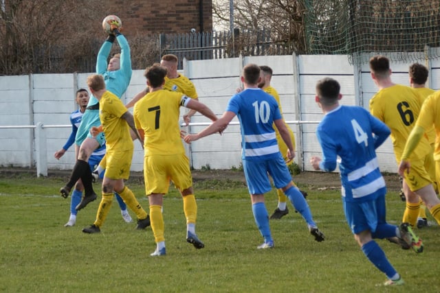 Hallam goalkeeper Myles Wright claims the ball well in a crowded goalmouth. Picture: Rob Hare