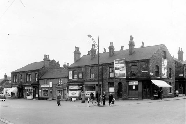 Balm Road and Woodhouse Hill Road in April 1959. In view is a grocers, a stationers and a newsagents as well as Hunslet Carr Post Office. On the end of the row is J Bradbury and Sons, a butchers.