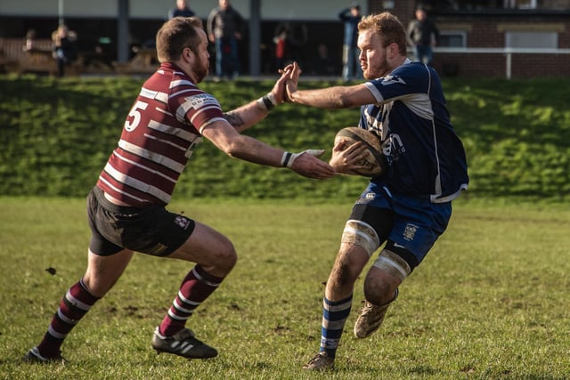 Brodie Matthews fends off the Rishworthians' defence. Picture: Jonathan Buck
