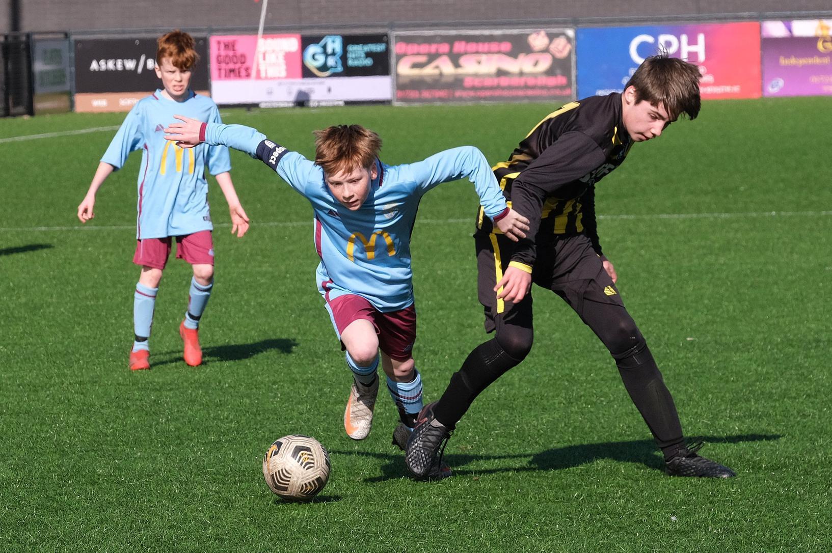 Cayton Under-13s get past Scalby Under-13s, yellow and black kit, in the Scarborough & District Minor League