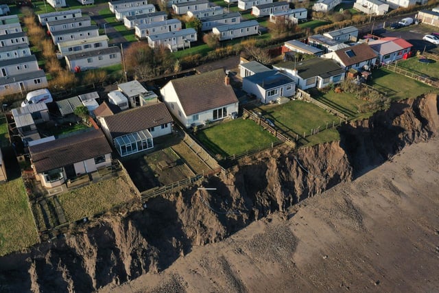 These Skipsea homes - photographed in 2020 - have the unenviable position of being along the fastest disappearing coastline in North West Europe. Owen Humphreys/PA Wire