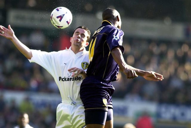 Gary Kelly clashes with Wimbledon's Marcus Gayle in mid-air.