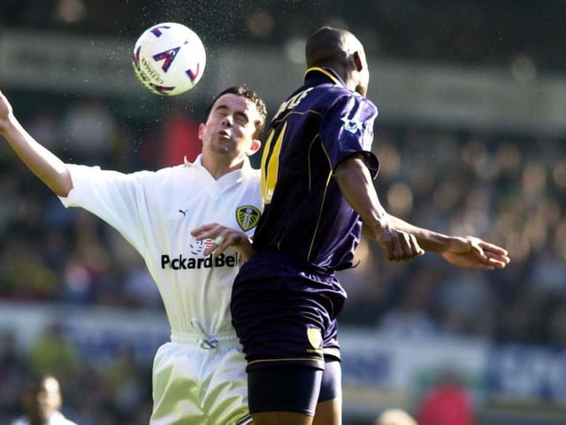 Gary Kelly clashes with Wimbledon's Marcus Gayle in mid-air.