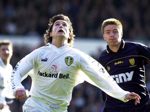 Harry Kewell looks up for the ball as Wimbledon's Trond Andersen follows in behind.