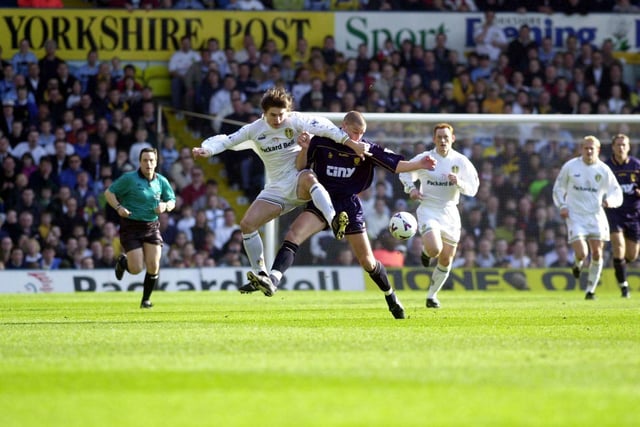 Harry Kewell clashes with Wimbledon's Chris Willmott.