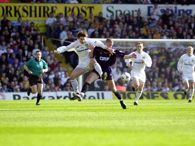 Harry Kewell clashes with Wimbledon's Chris Willmott.