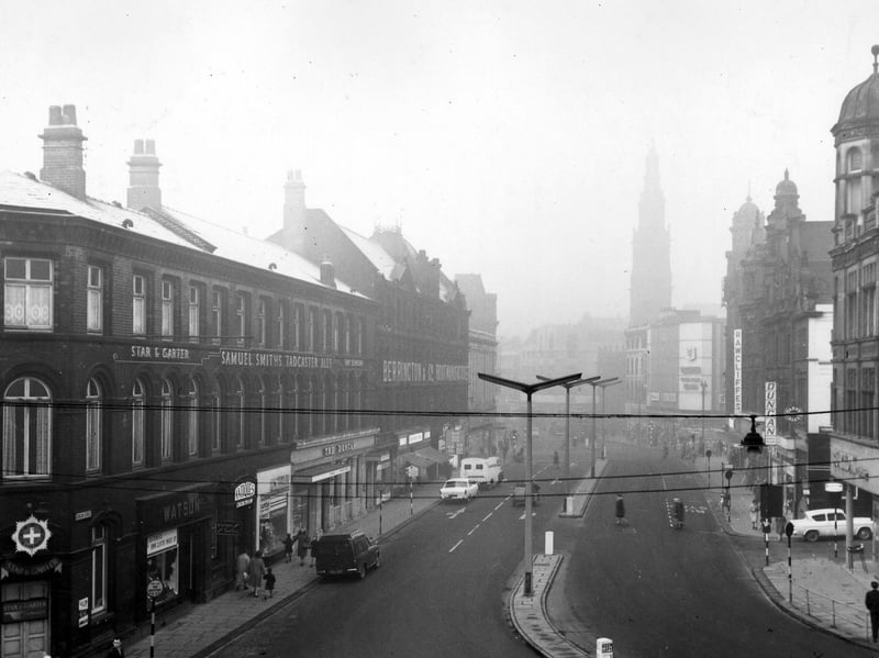 Duncan Street, Leeds, looking west towards Boar Lane, in January 1964. On the left are Star & Garter and the Duncan pubs. Shops in between include the tailors Watson and antique dealer W.W. Slee. Further along is the boot manufacturer Berrington & Co, with Burton's tailors and Rawcliffe's tailors, Saxone Shoes and the spire of Holy Trinity Church in the distance.