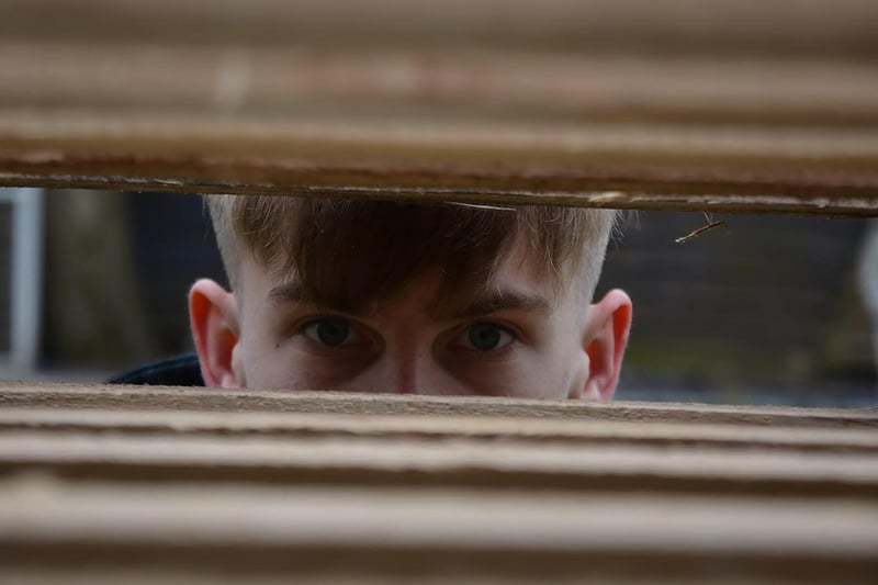 A young man peeks through in this photo by Blackpool Sixth student Abbie Lund.
