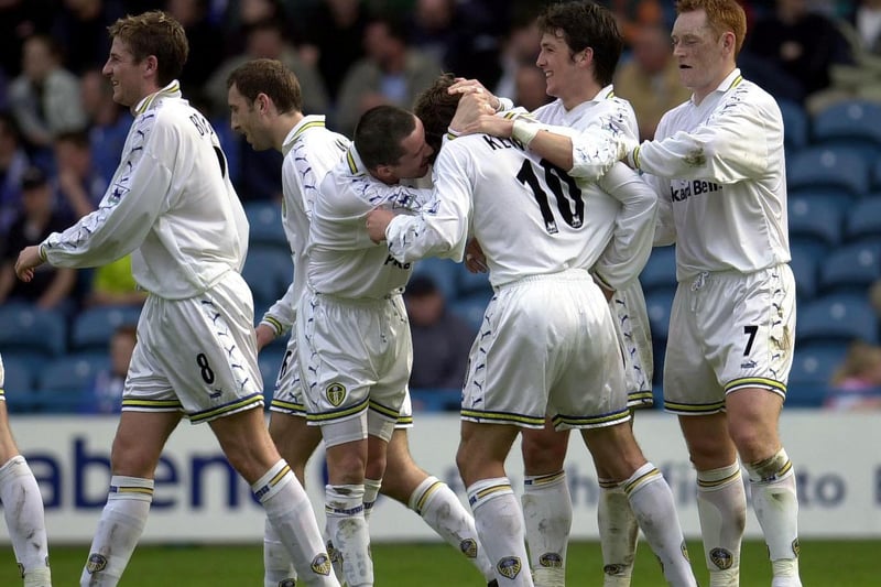 Harry Kewell celebrates with this teammates after chippingin for Leeds United's third goal.