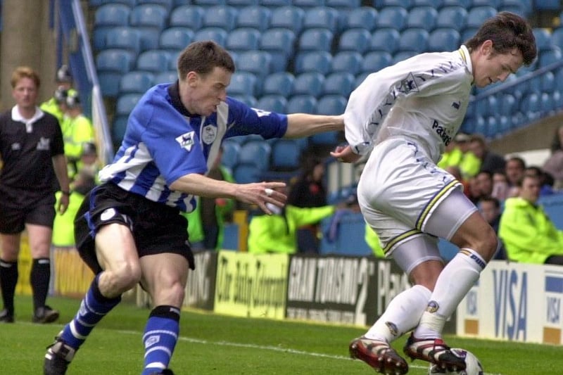 Matthew Jones protects the ball from Sheffield Wednesday's Ian Nolan.