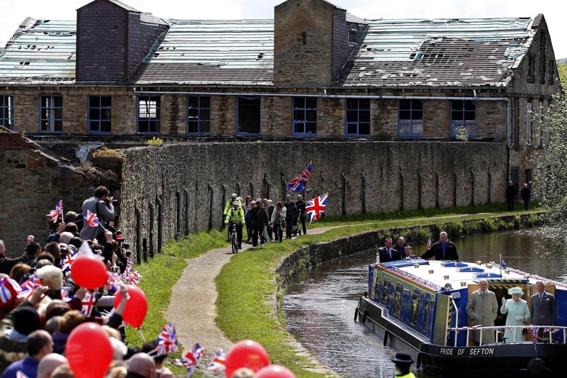 Crowds of well-wishers gather on the banks of the Leeds and Liverpool Canal, 2012