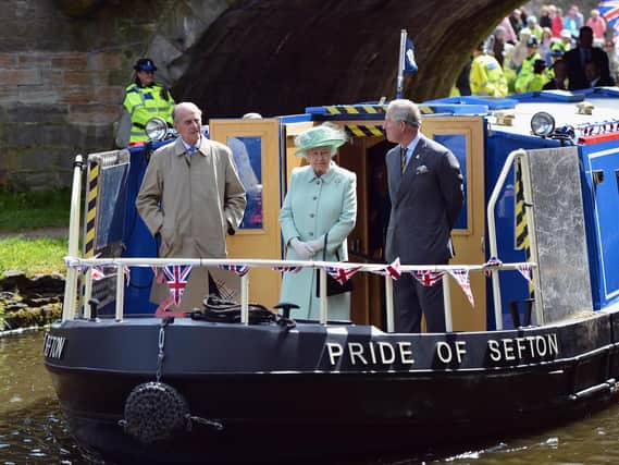 Prince Philip on board the Pride of Sefton on the Leeds and Liverpool Canal in 2012 with Her Majesty the Queen and Prince Charles