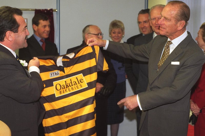 November 1995 and Prince Philip, Duke of Edinburgh, is presented with a Bramley RL shirt by Marshall Capel, chairman of Oakdale bakeries in Morley.