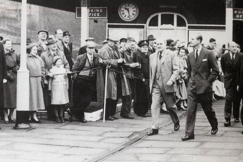 In this historic snap, Prince Philip passes through Horbury and Ossett train station during a visit to the Slazengers factory.