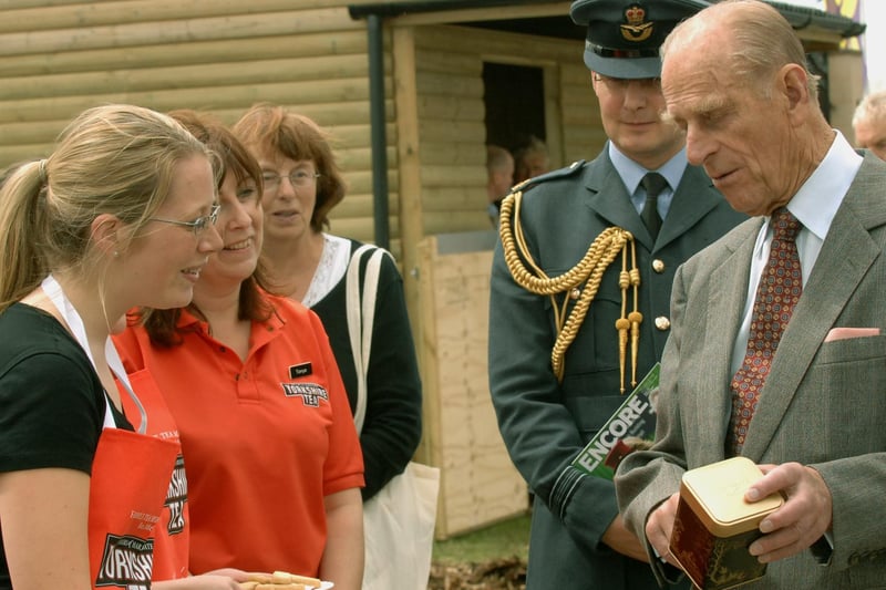The Duke of Edinburgh  recieves some Prince Philip Special Box Yorkshire Tea  from Liz Earl,  a Taylors of Harrogate employee at the 150th Great Yorkshire Show in Harrogate.