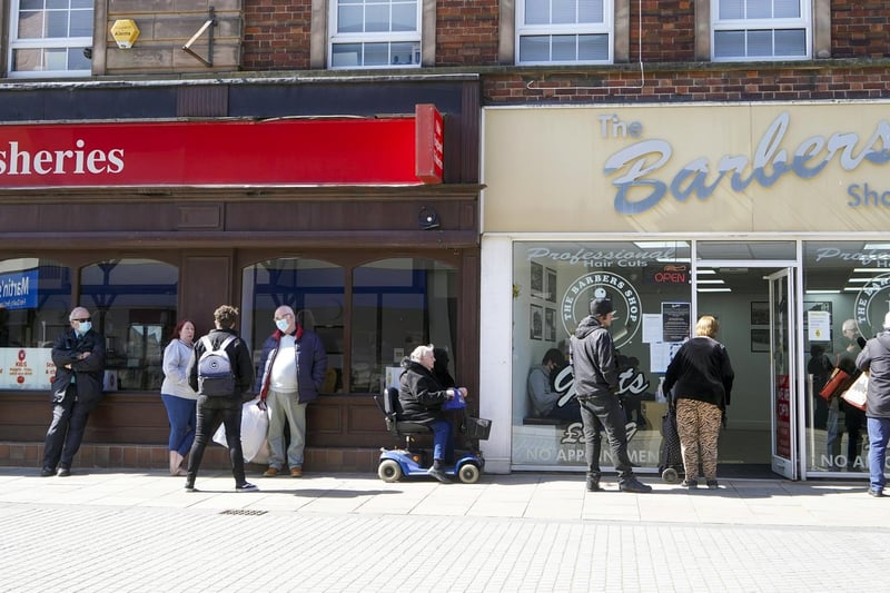 Long queues formed outside barbers as people waited excitedly to get rid of their lockdown locks.