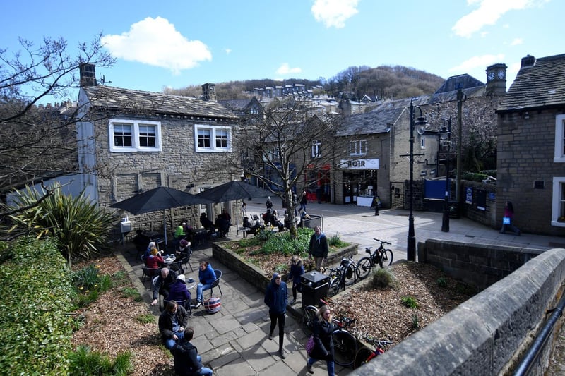 People sit outside bars and cafes at Hebden Bridge, as Covid 19 restrictions are relaxed. Picture by Simon Hulme