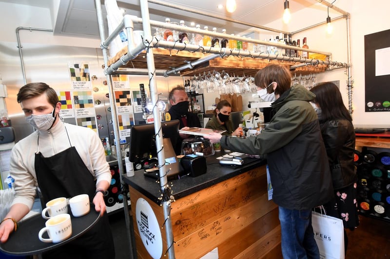 Coffee is served and vinyl records are sold at Loafers Vinyle and Coffee Shop. Owner Mark Richardson serves the customers. Picture by Simon Hulme.