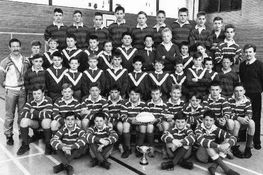 The front row is the under-13s team who won the Leeds Schools Rugby League Cup, the centre row is the under-12s team and the back row is the under-14s team