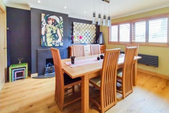 The dining room can be opened up to become an open plan living space, or be used for formal dining and entertainment. Like the living room, it has an oak floor, fireplace and light, airy feel.