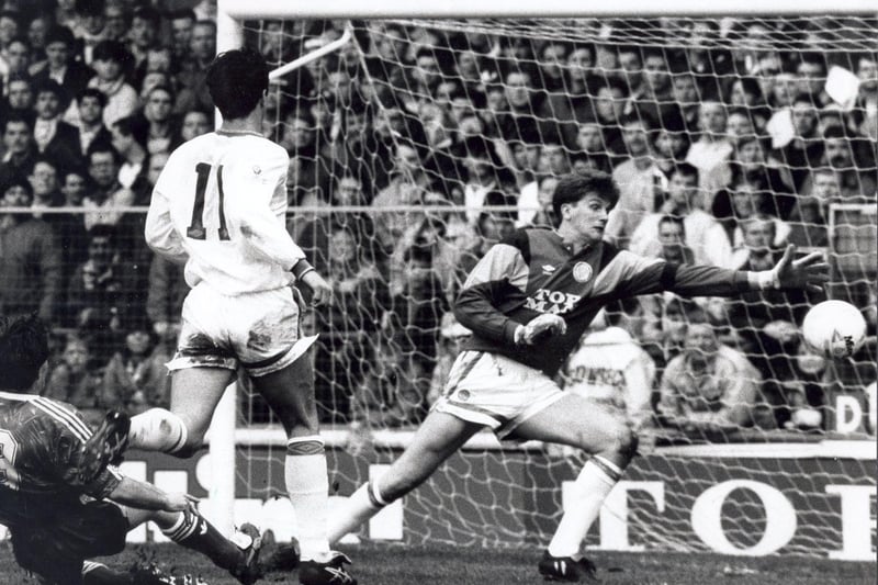 John Lukic holds out a despairing hand as Ray Houghton's shot goes wide.