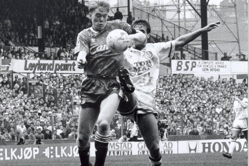 Liverpool's Steve Staunton shields the ball from Carl Shutt.