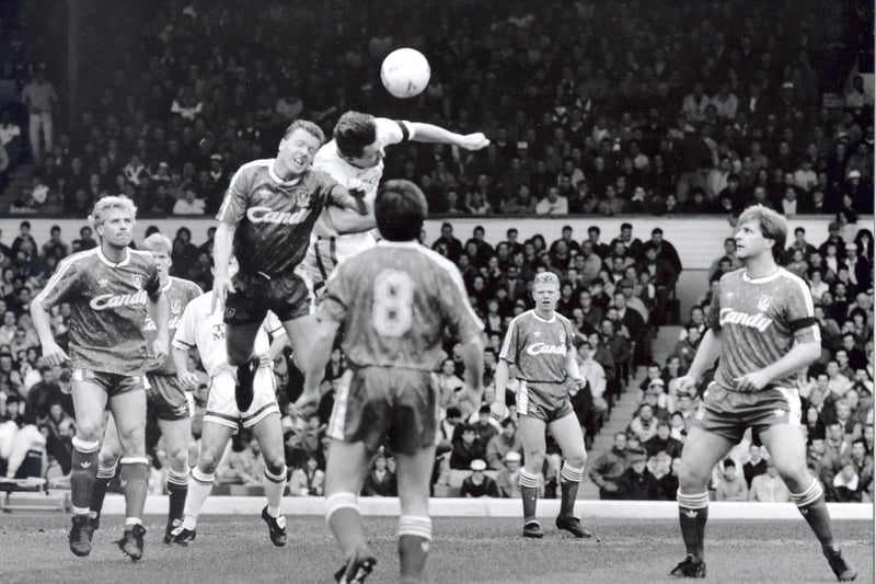 Lee Chapman beats Steve Nicol to the ball in an aerial duel. Glen Hysen, Ray Houghton, David Burrows and Jan Molby look on.