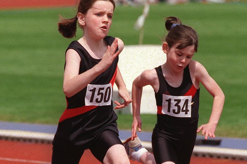 Natasha Collinson, left, competing against fellow Wigan Harriers in a Under 11s girls 75 metres race at the Junior Open meeting at Robin Park in 1999.