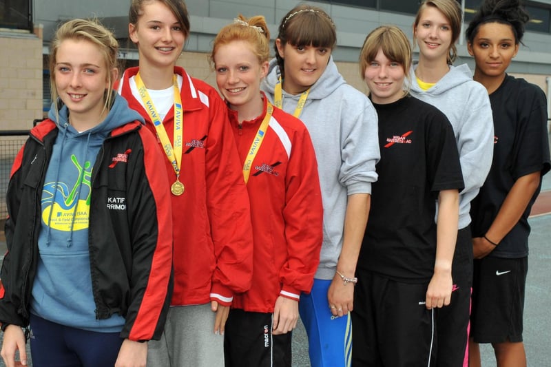 Wigan Harriers medalists, from left, Katie Farrimond, Kate Anson, Danielle McGifford, Micaela Brindle, Liane Bibby, Hannah Knowles, and Rayne Allman at Robin Park in 2010.