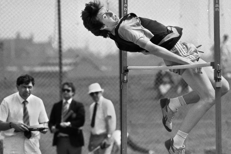Wigan Harrier's P. Crompton competing in the junior high jump at the Lancashire AA Track and Field Championships at Robin Park, May 1989.