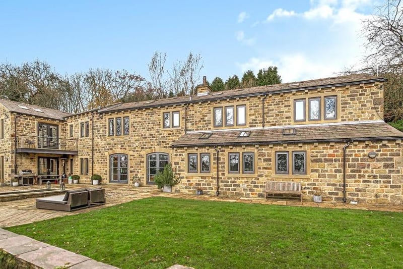 This beautiful home in Cliffe Drive in Rawdon is built from original Yorkshire Stone with a blue Welsh slate roof. The open plane living space is modern with underfloor heating and a high-spec kitchen. There are four bedrooms upstairs, with the master having a private balcony overlooking the garden. It is on the market for 1,750,000 with Fine & Country Manning Stainton.