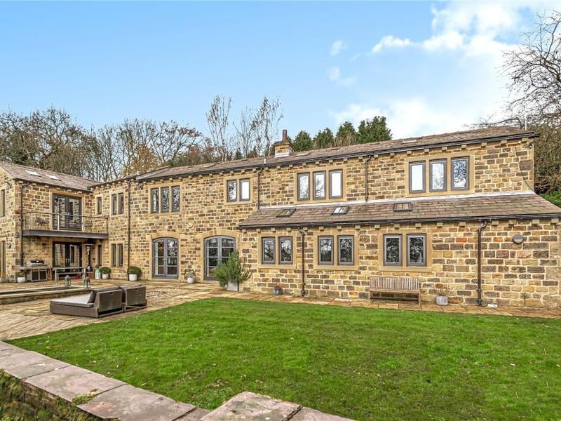 This beautiful home in Cliffe Drive in Rawdon is built from original Yorkshire Stone with a blue Welsh slate roof. The open plane living space is modern with underfloor heating and a high-spec kitchen. There are four bedrooms upstairs, with the master having a private balcony overlooking the garden. It is on the market for 1,750,000 with Fine & Country Manning Stainton.