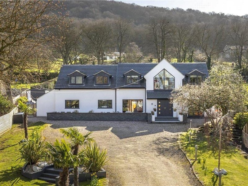Chevin Close is a superb, modern mansion in Birdcage Walk in Otley. The stunning home has lots of space for the family but also some fantastic and unique features such as a home gym, large hot tub, football pitch, children's play area, summer house and a miniature putting green.It is on the market for 1,400,000 with Dacre, Son & Hartley.