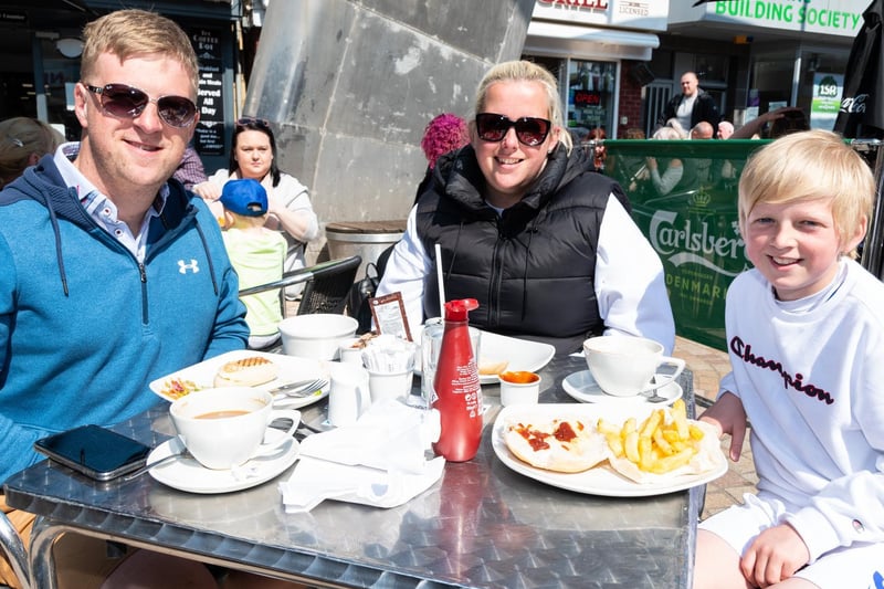 Gary, Jen and Harry Marcus soak up the sun and enjoy a chip butty at Coffee Pot.