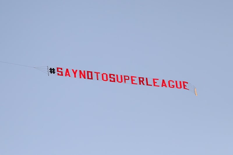 A plane with a 'Say No To Super League' banner flies over Elland Road.