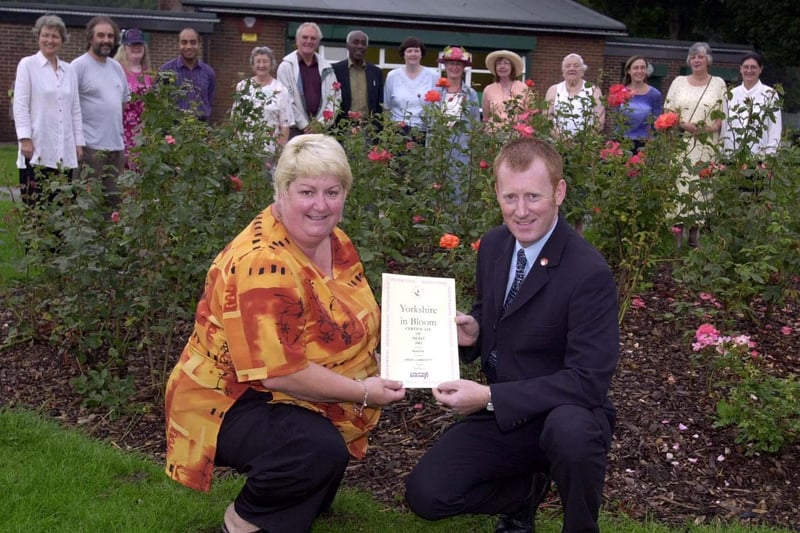 August 2001 and green fingered Beeston resitdents were celebrating after finishing fourth in Yorkshire in Bloom. Pictured is Coun Angela Gabriel recieving a certificate from Richard Gill.