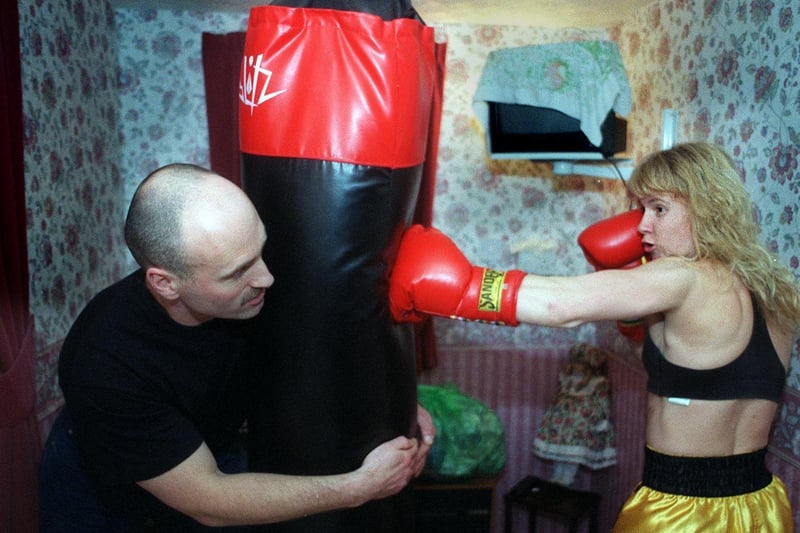 Boxer Michelle Sutcliffe was due to fly to America for a title fight in May. She is pictured training with her husband Gary.