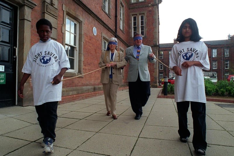 Presenter Richard Whiteley and Lord Mayor of Leeds, Coun Linda Middleton, are led blindfolded by Ruthba Amin and Rimmel Walwyn to launch the River Blindness Campaign at the Thackray Medical Museum.
