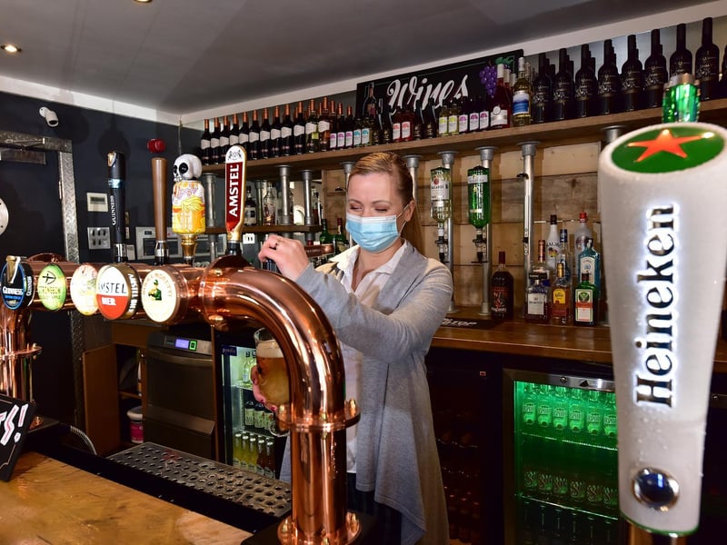 Manager Lelde Caune prepares drinks.