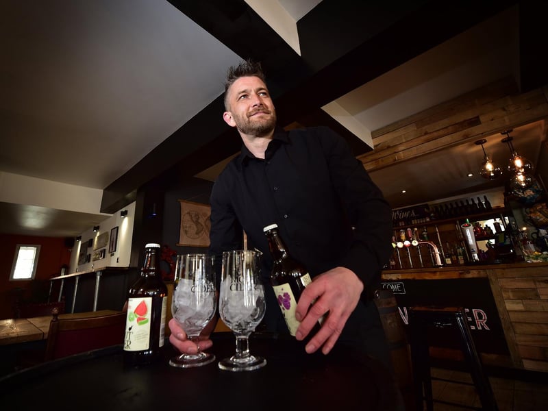 Manager Ray Clarkson prepares drinks.