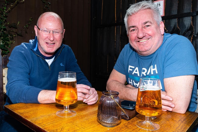 Drinkers enjoy a drink in The Wellington, Preston.