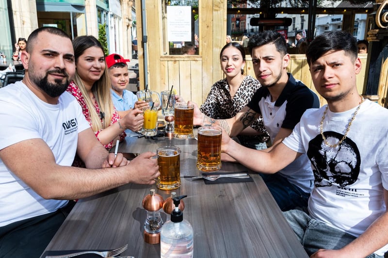 Andrei Vaduva, Andreea Roxana, Bianca Frunza, Viorel Adrian, and Alin Madalin enjoy a drink at Olive Tree Brassiere.
