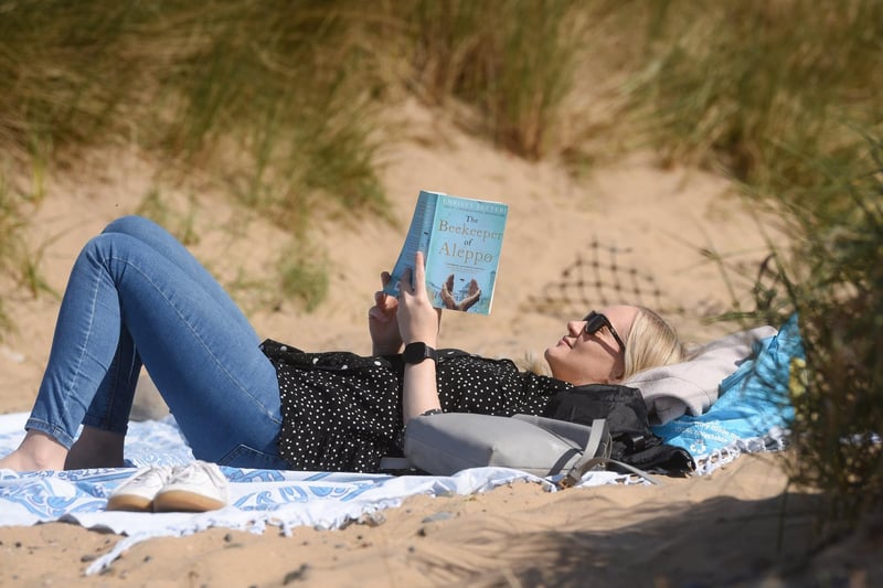 And relax! Rachel Campbell reads a book in the sun.