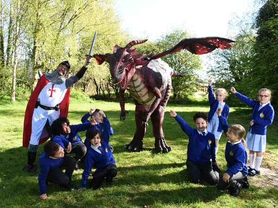 Pupils at Eldon Primary School with St George and the legendary dragon.