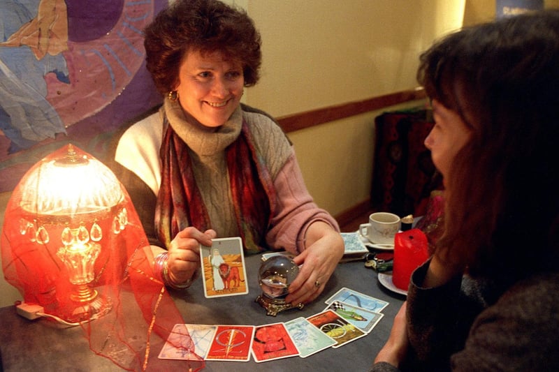 YEP reporter Lesley Gibson (right) receives a tarot card reading from Eileen Rose at the Psychic Fayre held at Pudsey Civic Centre in January 1996.