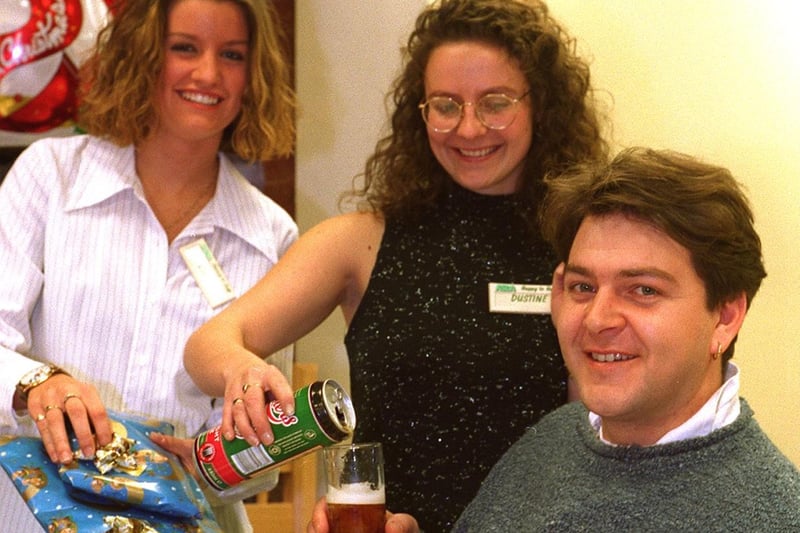It was 'Blokes Night'  at ASDA's Owlcotes Centre store in December 1996. Ian Lovering enjoys a curry and a beer after having his Christmas gifts wrapped. Also pictured is checkout opperator Claire Ward (left) and trading assistant Justine Freear.